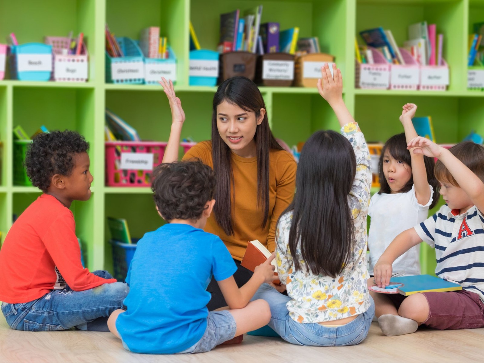 Teacher with students - GCCS Business
