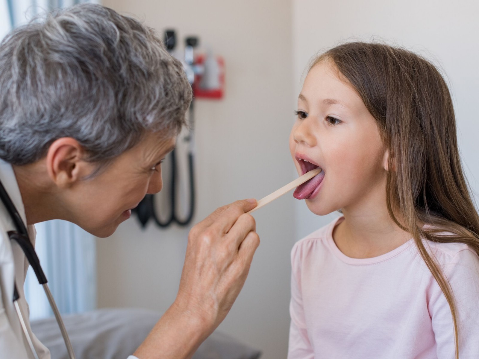 Girl with doctor - GCCS Health Services