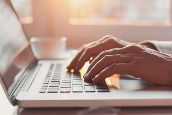Typing on a laptop computer