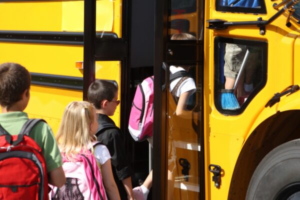Kids getting on the school bus