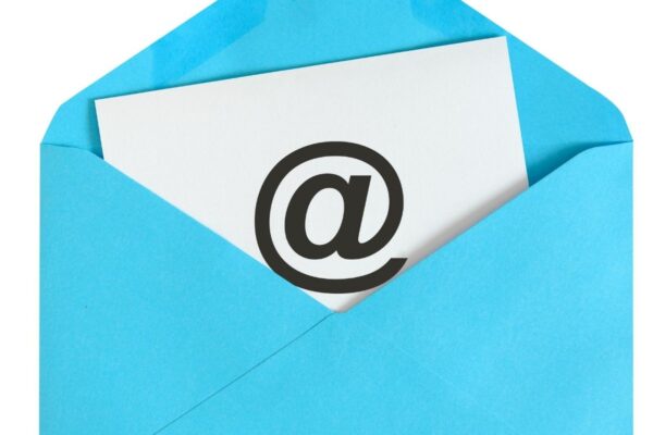 Photo of envelope with letter with @ written on it.