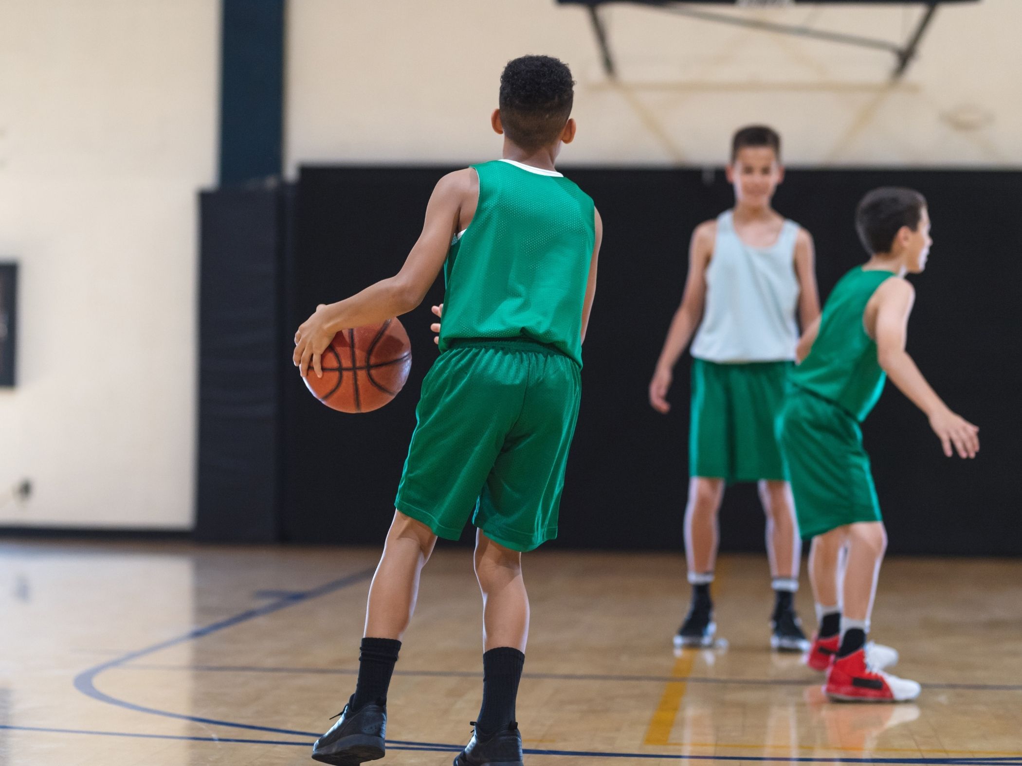 Student playing basketball
