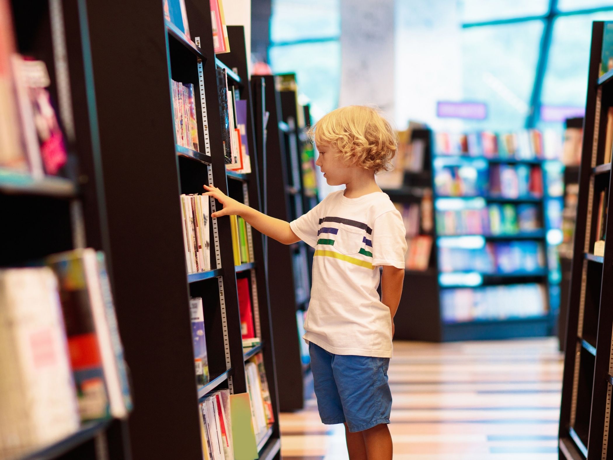 Child looking for book