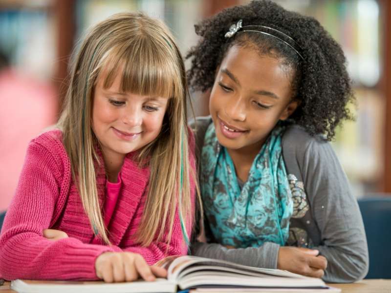 Two students reading together